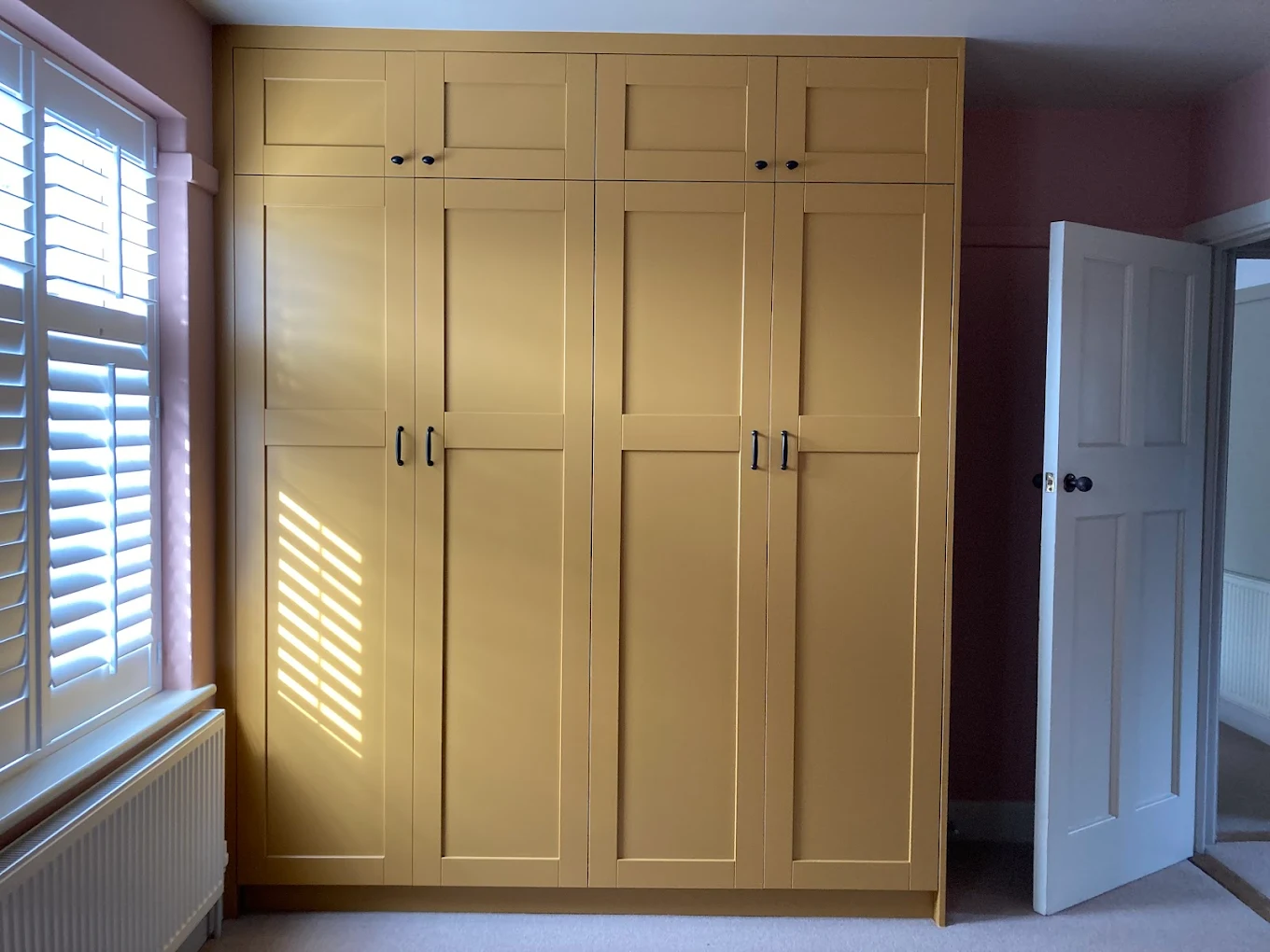 Bespoke painted shaker fitted wardrobes by D.K. Carpentry