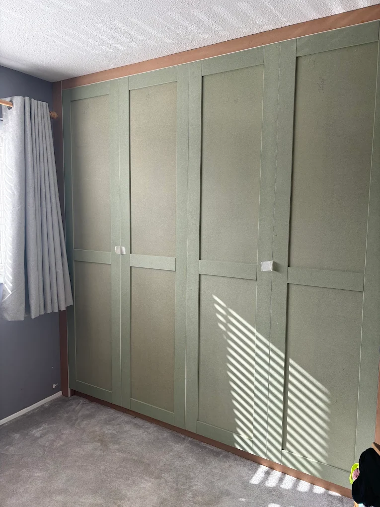 Sage-green shaker fitted wardrobes by D.K. Carpentry